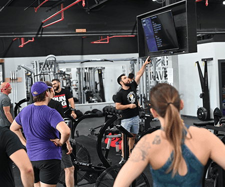 Athletes lifting at Man O' War Fitness during a programmed class.